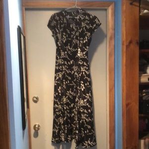 The J. Peterman Company Black silk dress with white Lily of Valley floral print